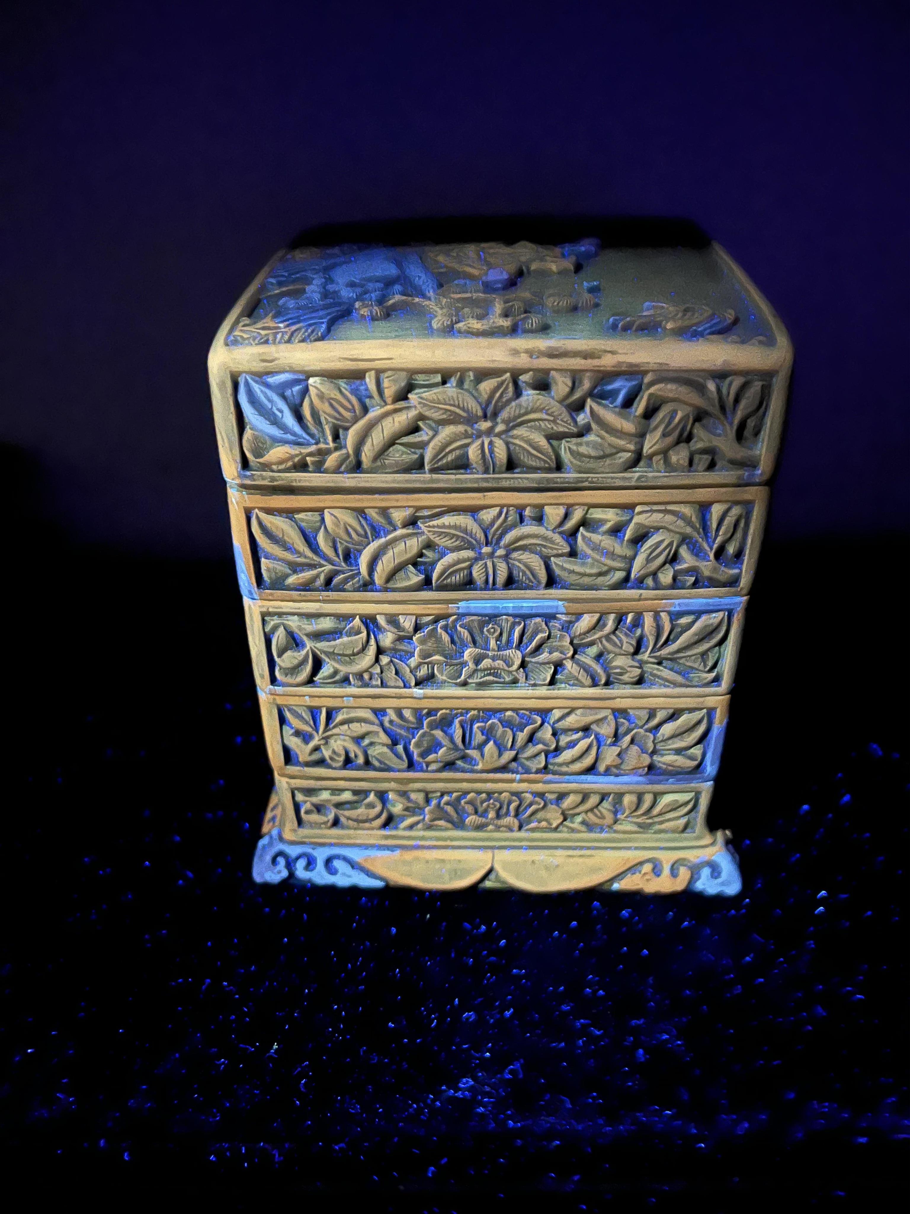 A Chinese Ming cinnabar lacquer four tier box, 15th century